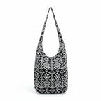 Two black and white patterned bags on a white background