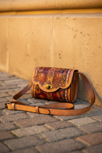 Close-Up Bag on Cobblestones Against Limestone Wall