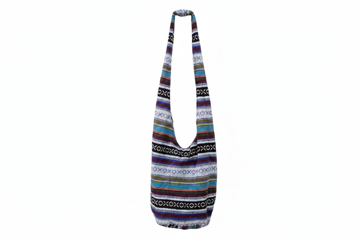 Two patterned shoulder bags on a white background